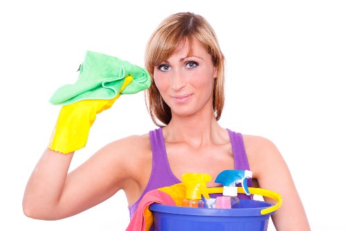 Carpet cleaning technician working safely in a home with protective equipment